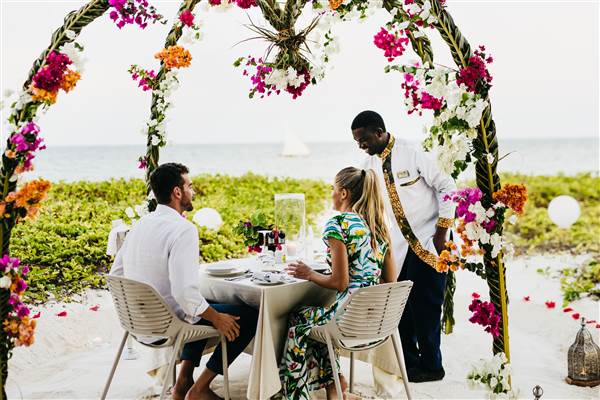 Honeymoon couple enjoying a romantic safari and sunset in Tanzania/Zanzibar.