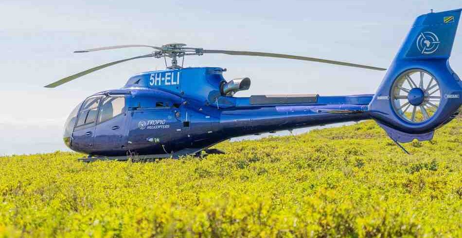 Helicopter scenic flight over Mount Kilimanjaro and northern Tanzania landscapes with panoramic aerial views