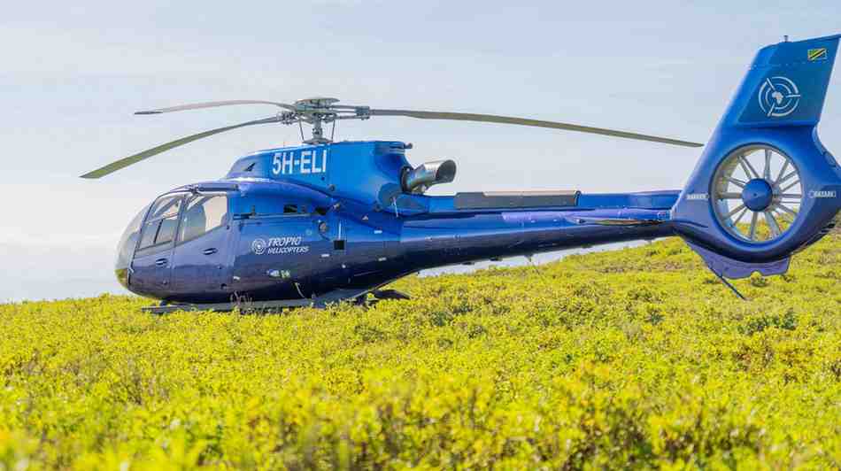 Helicopter scenic flight over Mount Kilimanjaro and northern Tanzania landscapes with panoramic aerial views