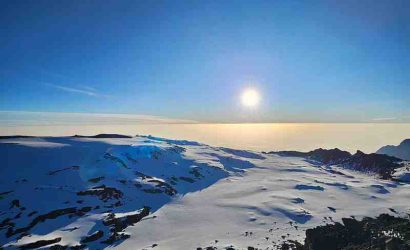Panoramic view of Mount Kilimanjaro showcasing Tanzania's iconic trekking landscape with Ibhanilfa Safaris.