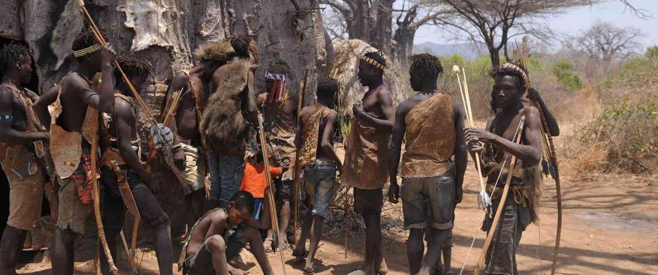 Hadzabe community members gathered during a cultural visit